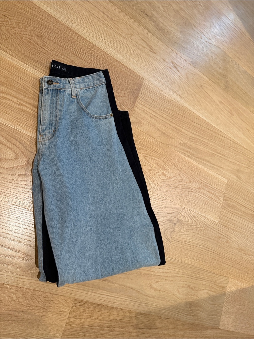 Lioness Light Blue Denim Jeans with Black denim back of the jeans